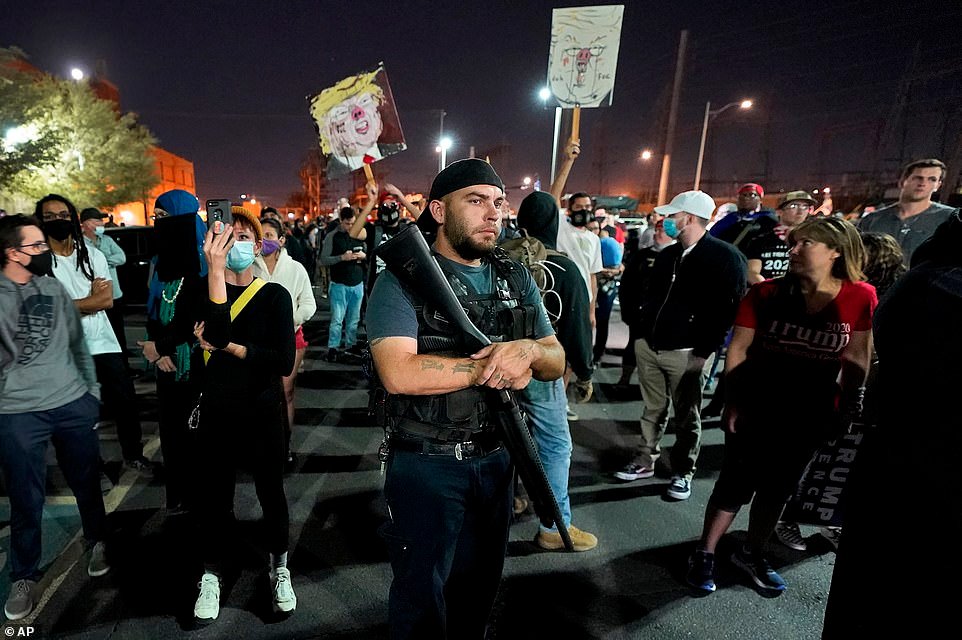 Armed protesters in Phoenix swarmed the building where election workers were counting Wednesday night.