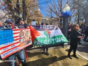 Two flags. The American Flag and a Palestinian flags.